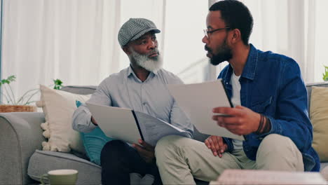 Planning,-father-and-son-with-paperwork