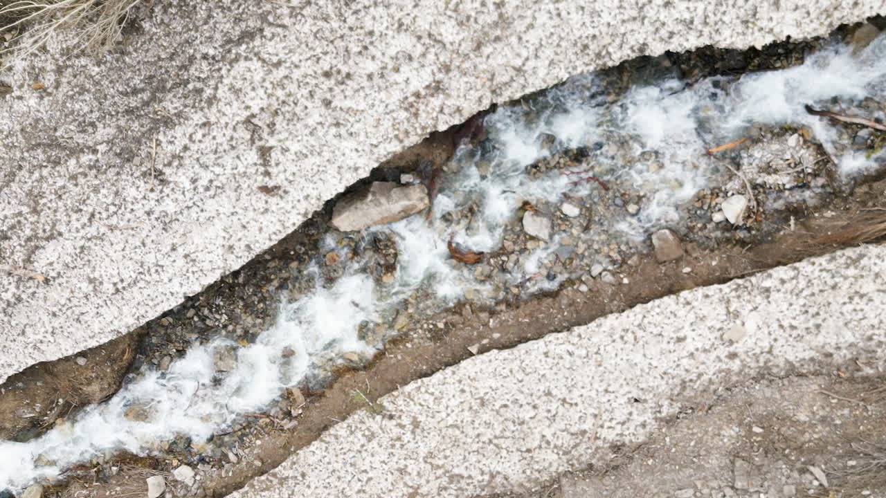 Bird's eye view of the melting ice and snow after the avalanche in Provo Canyon, Utah