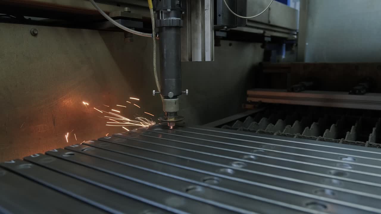 Modern industrial laser machine with CNC, Metal cutting technology. Laser cutting of steel pipes in a modern factory. Laser cuts holes in the pipe.