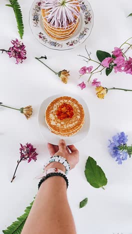 delicate pancakes and floral arrangement