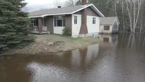 aerial shot of flooded homes, trailers, and streets in quebec neighborhood.