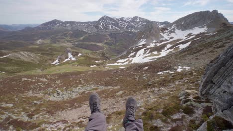male hiker enjoying the view of the picu torres in asturias in spain. body shot