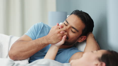 happy couple in communication on bed