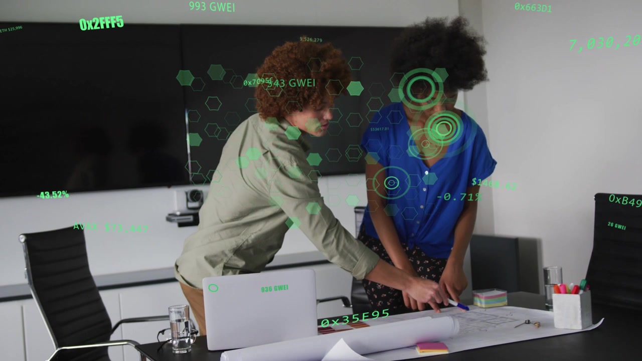 Two designers after plan unroll, leaning and pointing as HUD highlighting details for design review
