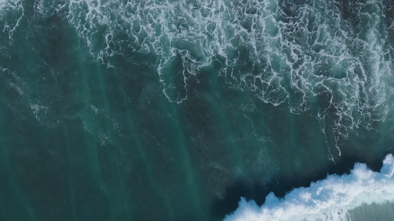 Top Down Slow Motion Drone shot of abstract wave motion and patterns in Uluwatu Bali Indonesia