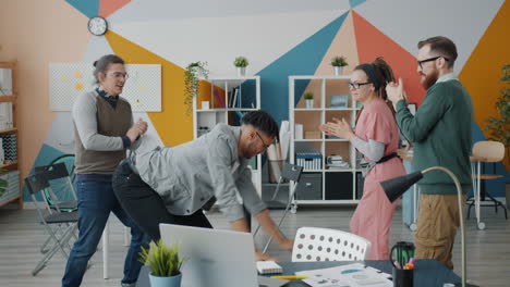 team celebrating in a modern office