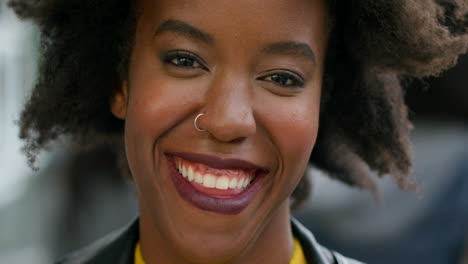 Young-african-woman-with-an-afro-smiling-during