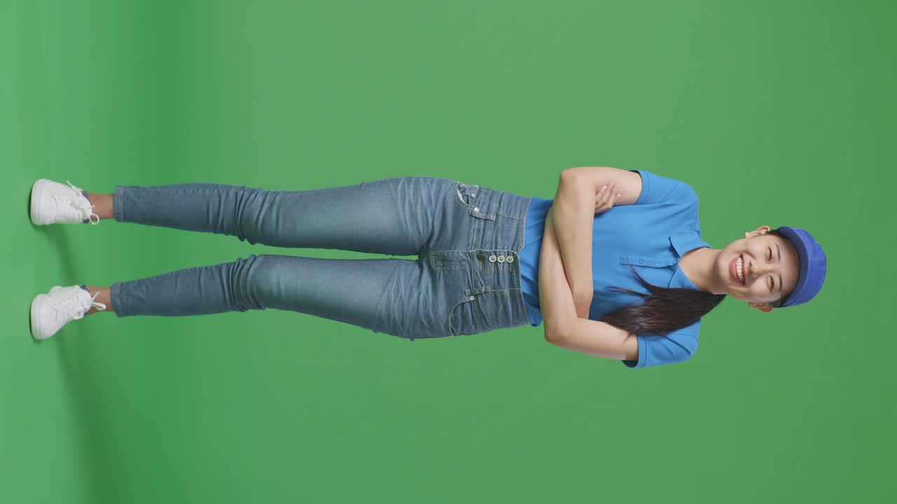 Woman in Delivery Uniform on Green Screen