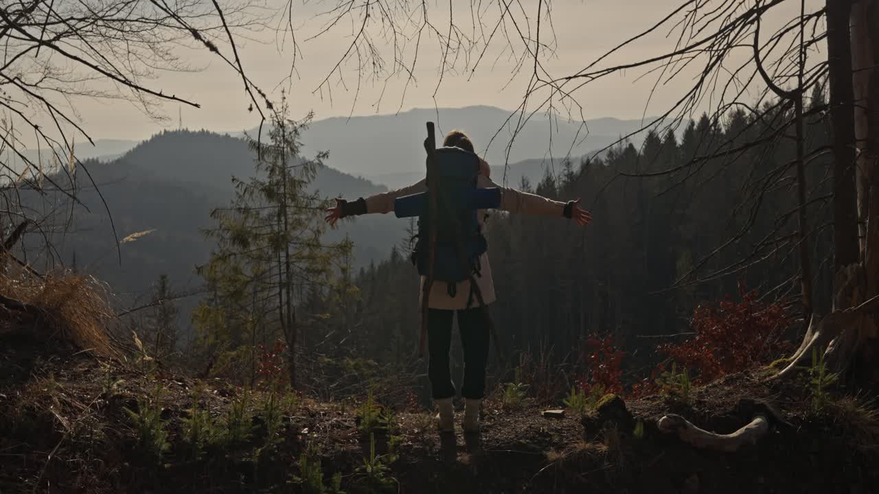 Hiker with Backpack Enjoying Mountain View