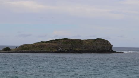 static view of a small, rocky island in the sea