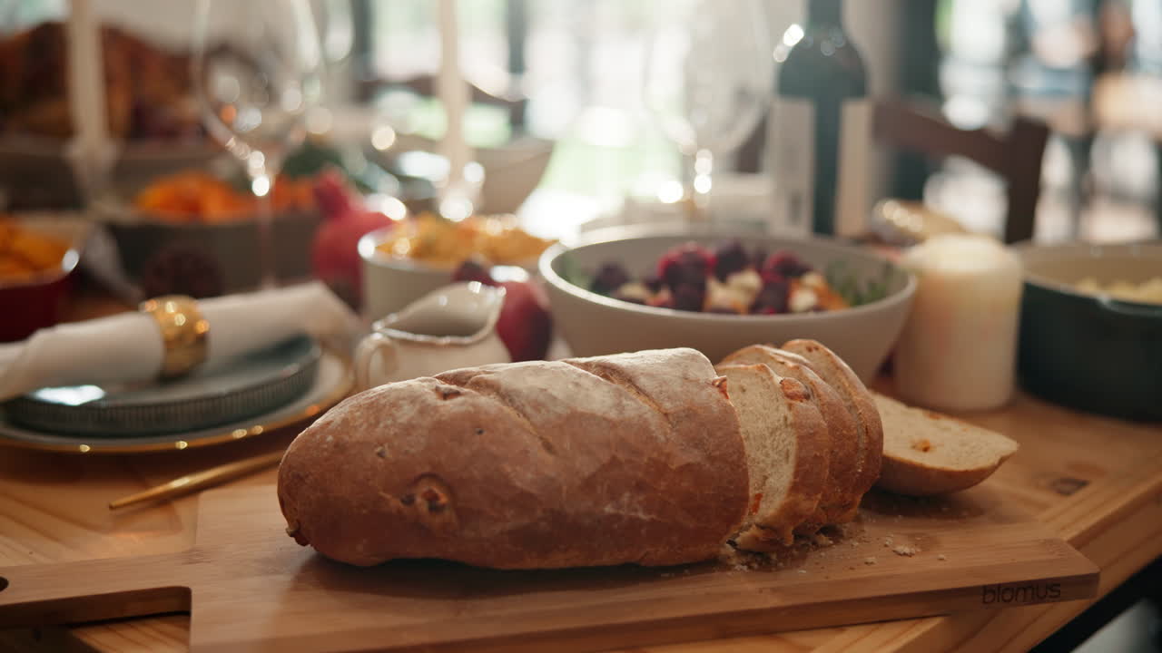 A sliced loaf of bread on a dining table