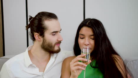 couple kissing on the sofa