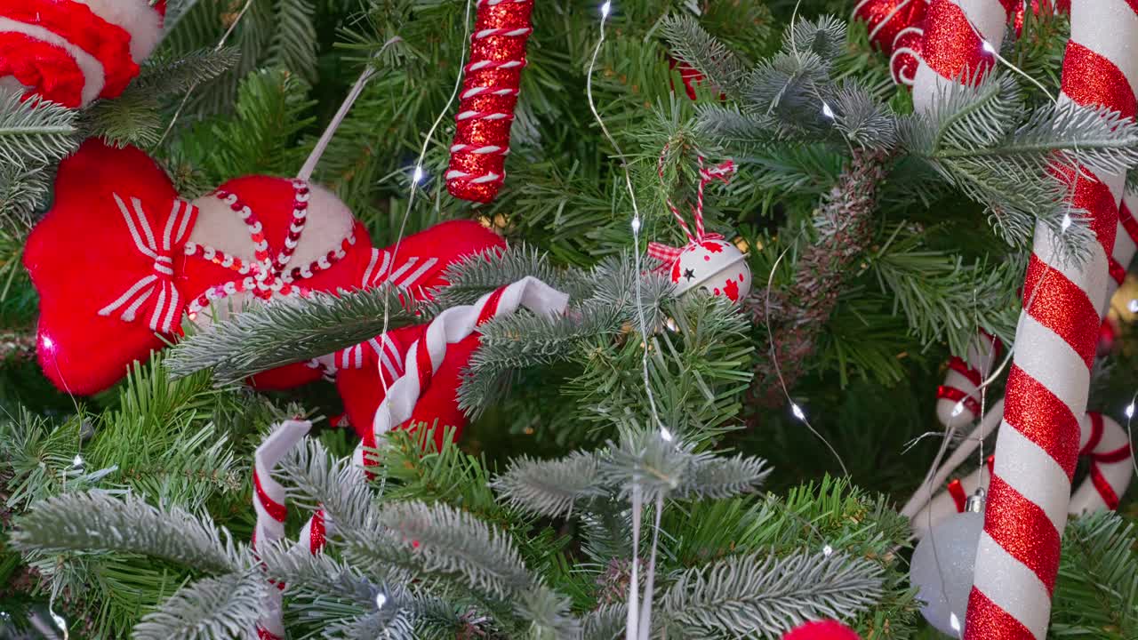 Christmas tree with fairy lights and trimmings. Decorations and balls with festive concept. Merry Christmas