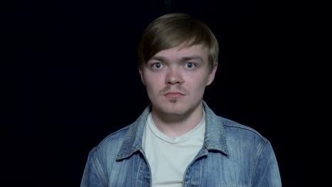 portrait of a young man with a serious expression.