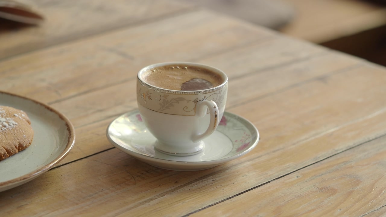Close-up of Turkish Coffee and Cookie on Rustic Wooden Table
