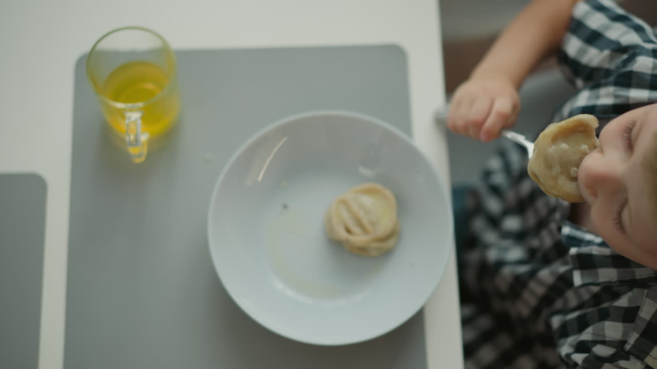 Child Eating Dumplings