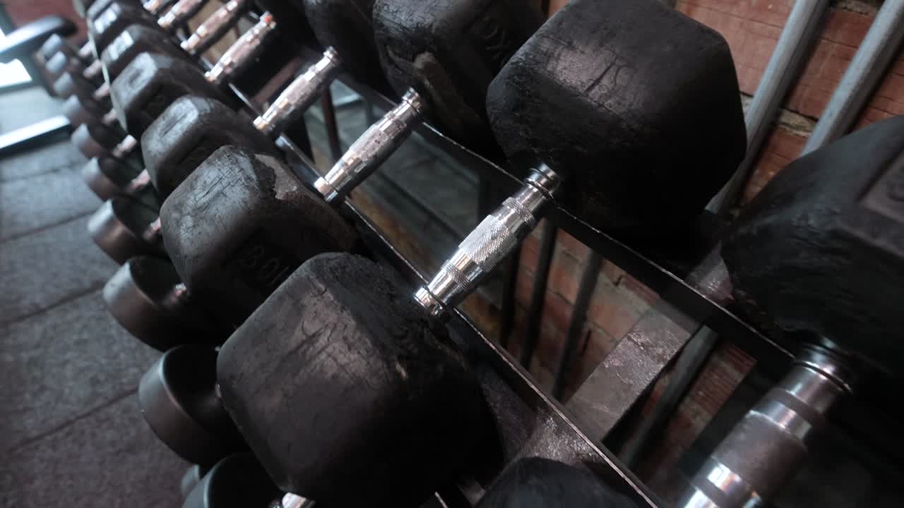 Panning Right: Gym Weight Escalation Rack in Focus