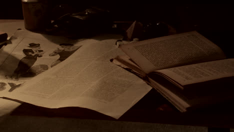 vintage desk with antique items and newspapers