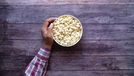 person eating popcorn