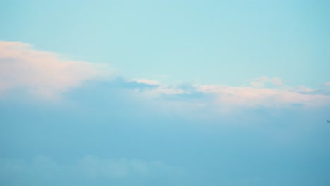 flying plane in a stormy weather, blue sky, surfing clouds, 4k video