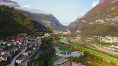 aerial view of a town nestled in a mountain valley in autumn