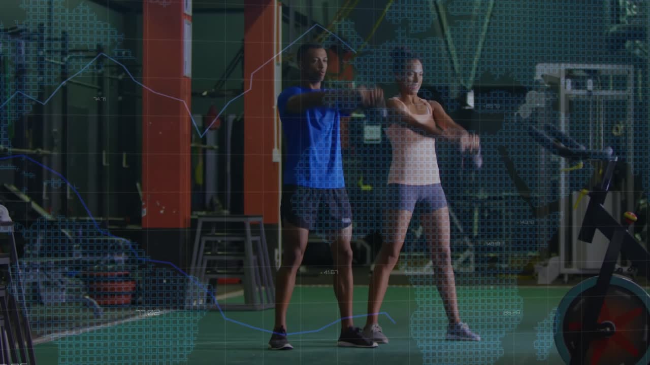 Fitness partners initiating kettlebell swings on turf while holographic charts tracking performance