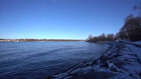 Niagara-on-the-lake-during-winter-with-snow-and-ice---Lake-Ontario-during-cold-winter-day-with-bright-blue-sky