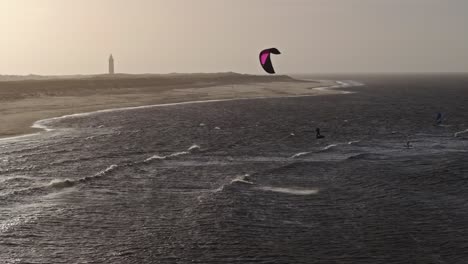 kiteboarding and windsurfing on a beautiful coastal scene