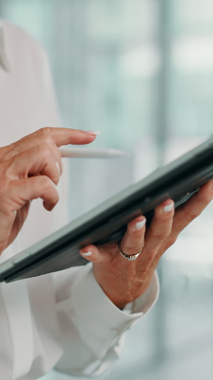 Close Up of Hands Using Digital Tablet with Stylus