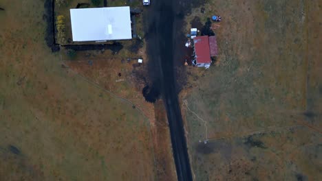 top down aerial view of buildings in barren icelandic landscape