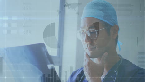 animation of data processing over asian male doctor with x ray scan