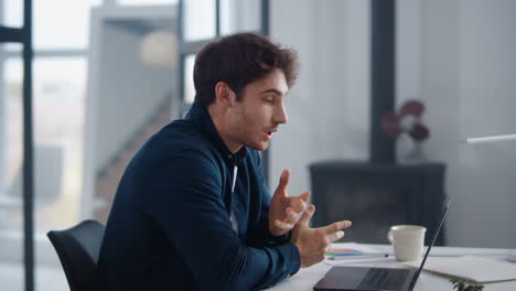 Smiling-business-man-talking-on-video-conference.-Handsome-man-having-video-call