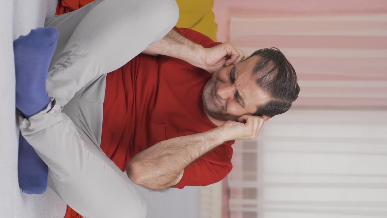 Vertical video of Earache. Itchy ear problem.