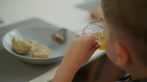 child eating and drinking