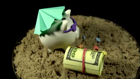 a white piggy bank stands on a sandy beach and revolves on a black background.