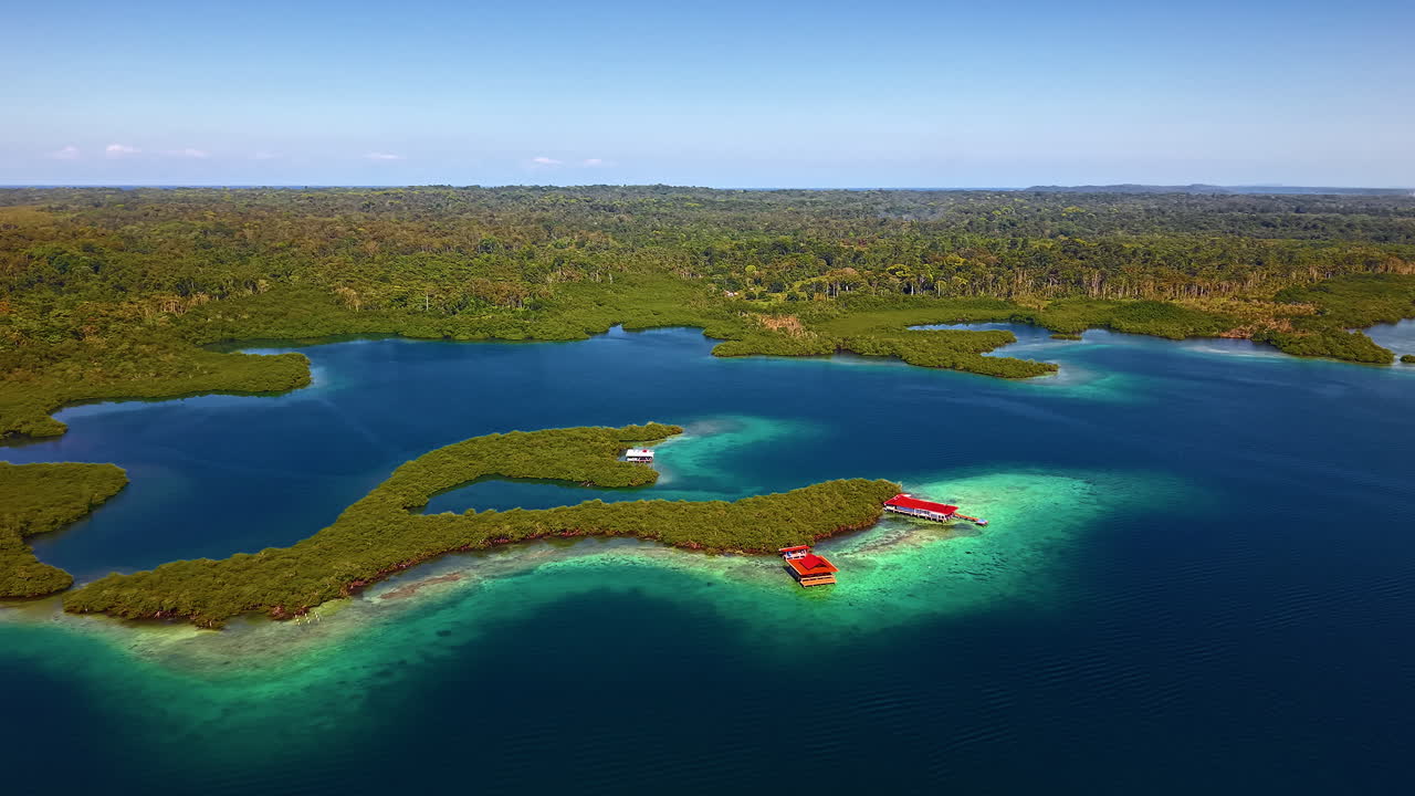 Tropical Green Island Boca del Drago In Bocas del Toro, Panama. wide aerial shot