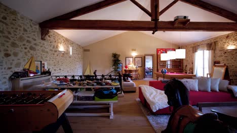 slow revealing shot of an antique games room with toys and rocking horses