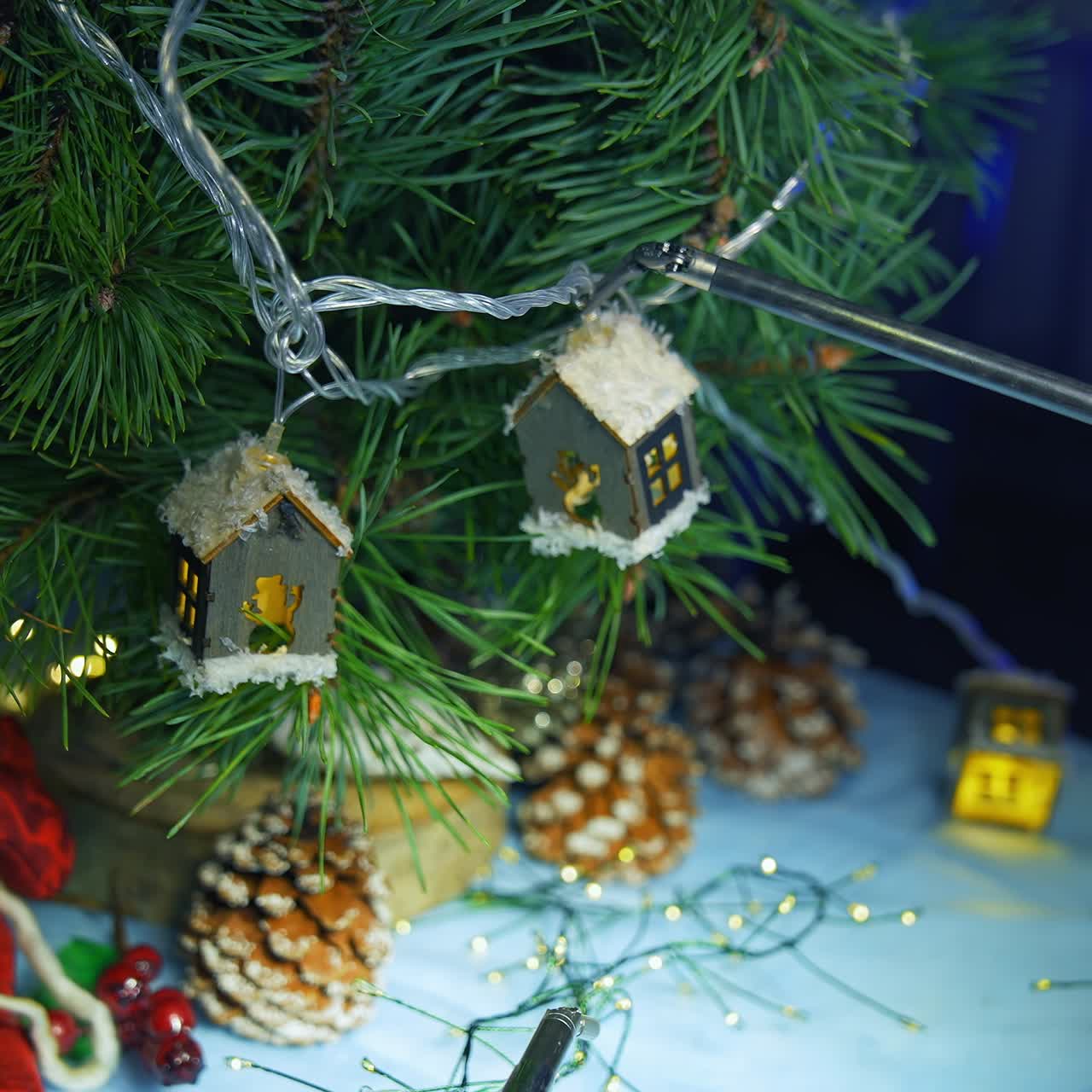 Artificial intelligence robot decorating Christmas tree. Modern robotic equipment hang toys on a fir tree. Robotic industry