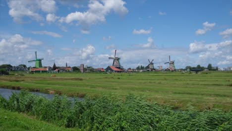 traditional dutch windmills in a scenic green landscape