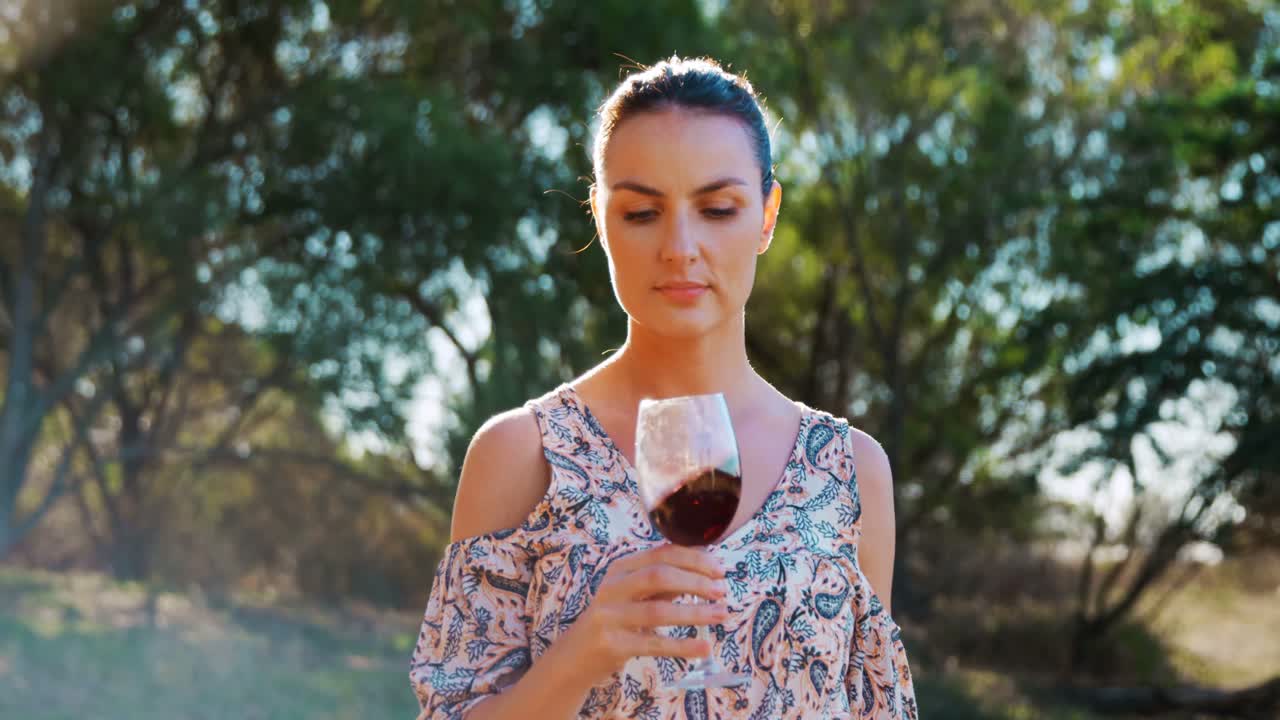 Woman smelling red wine 4k
