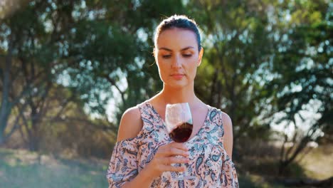 woman smelling red wine 4k