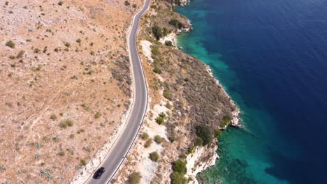 AERIAL-Fly-By-over-a-Coastal-Mountain-Road-in-Albanian-Riviera