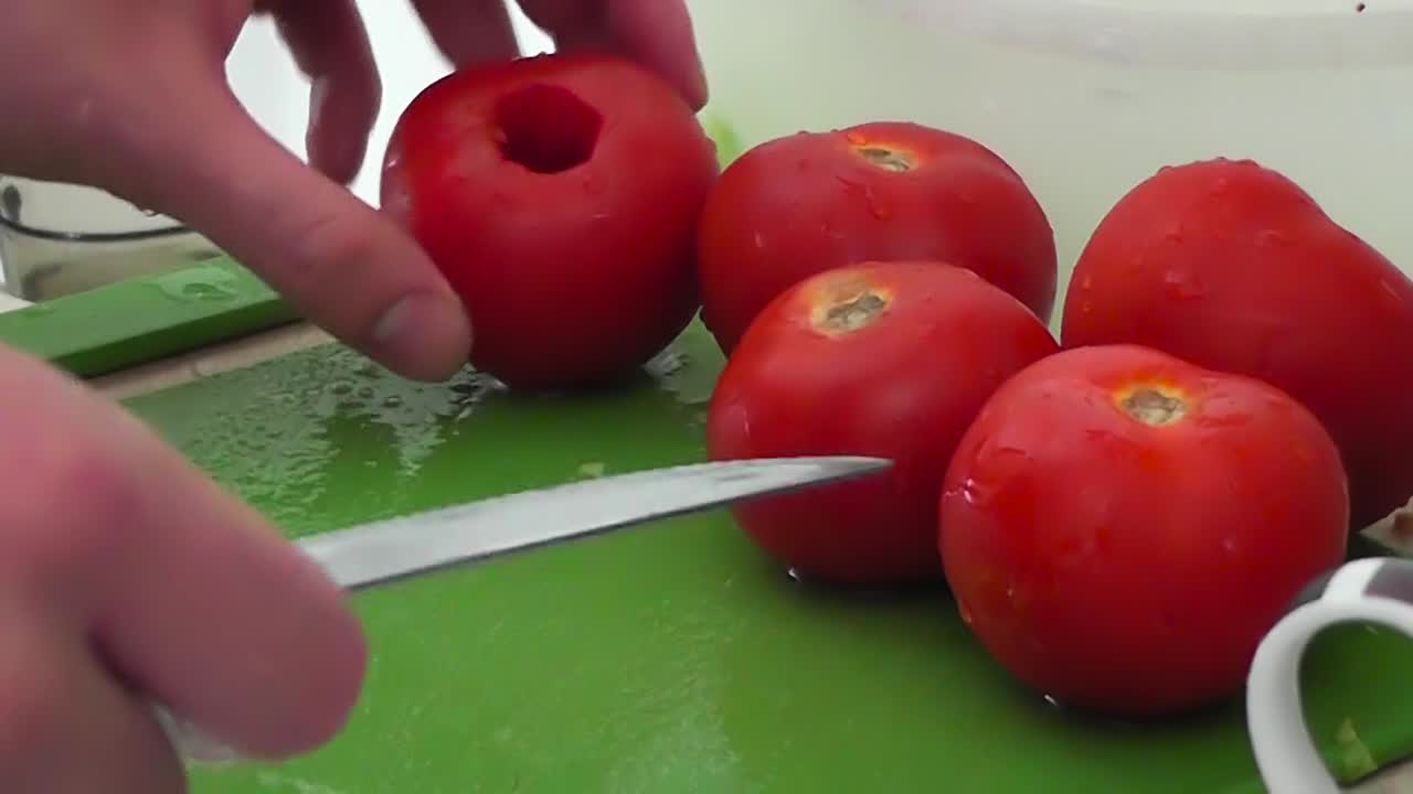 Preparing fresh tomatoes for salad