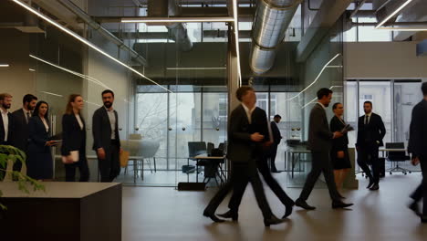 busy professionals walking through a modern corporate office