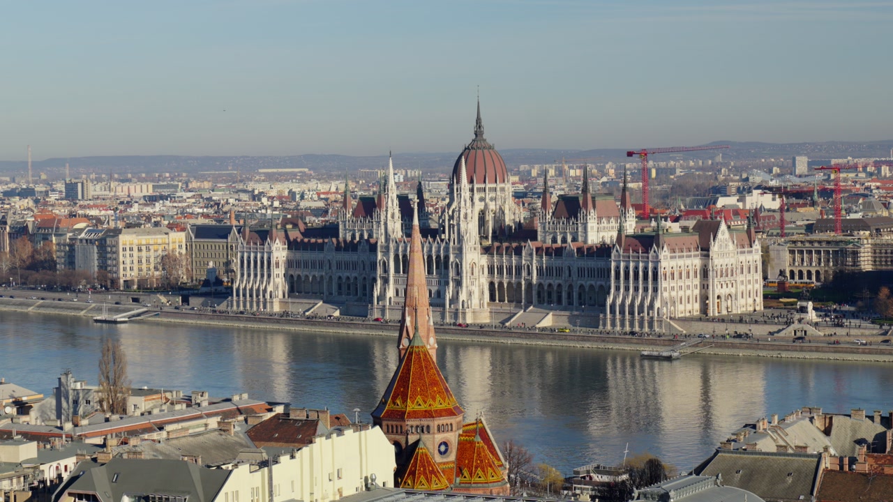 Hungarian Parliament building across Danube River with Budapest city skyline view