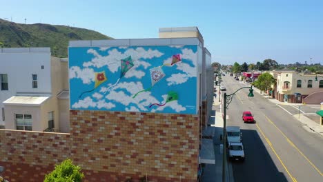 Aerial-Over-The-Avenue-Section-Of-Ventura-California-From-Kite-Mural-To-Street-Businesses-And-Offices-Visible-Southern-California-Or-Los-Angeles