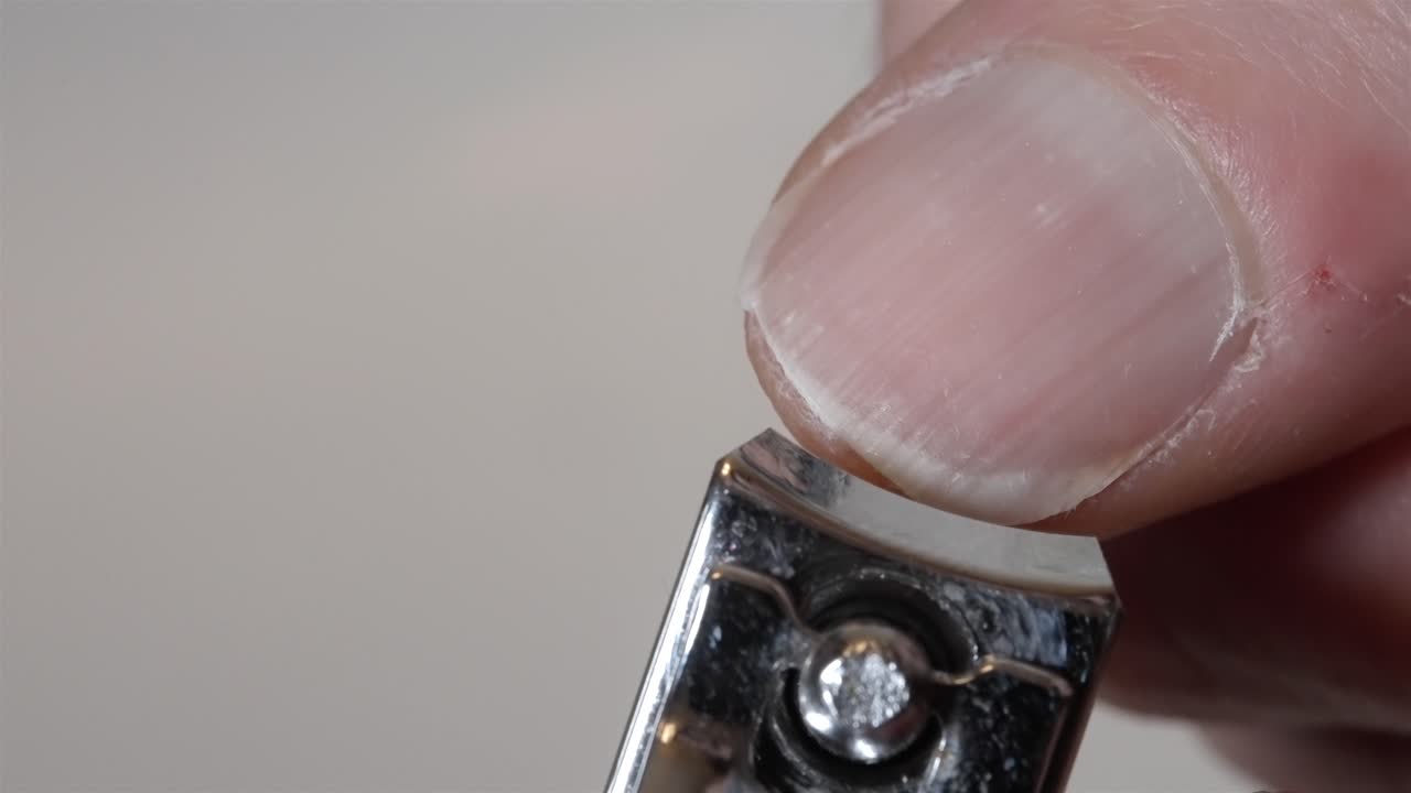 Nail Clipping Fingernail with Metal Clipper - Close Up View