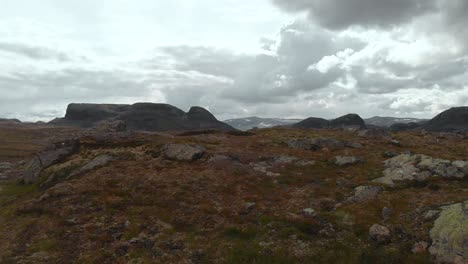 Hardangervidda-rural-valley-landscape,-Norway-mountain-plateau,-aerial-reveal