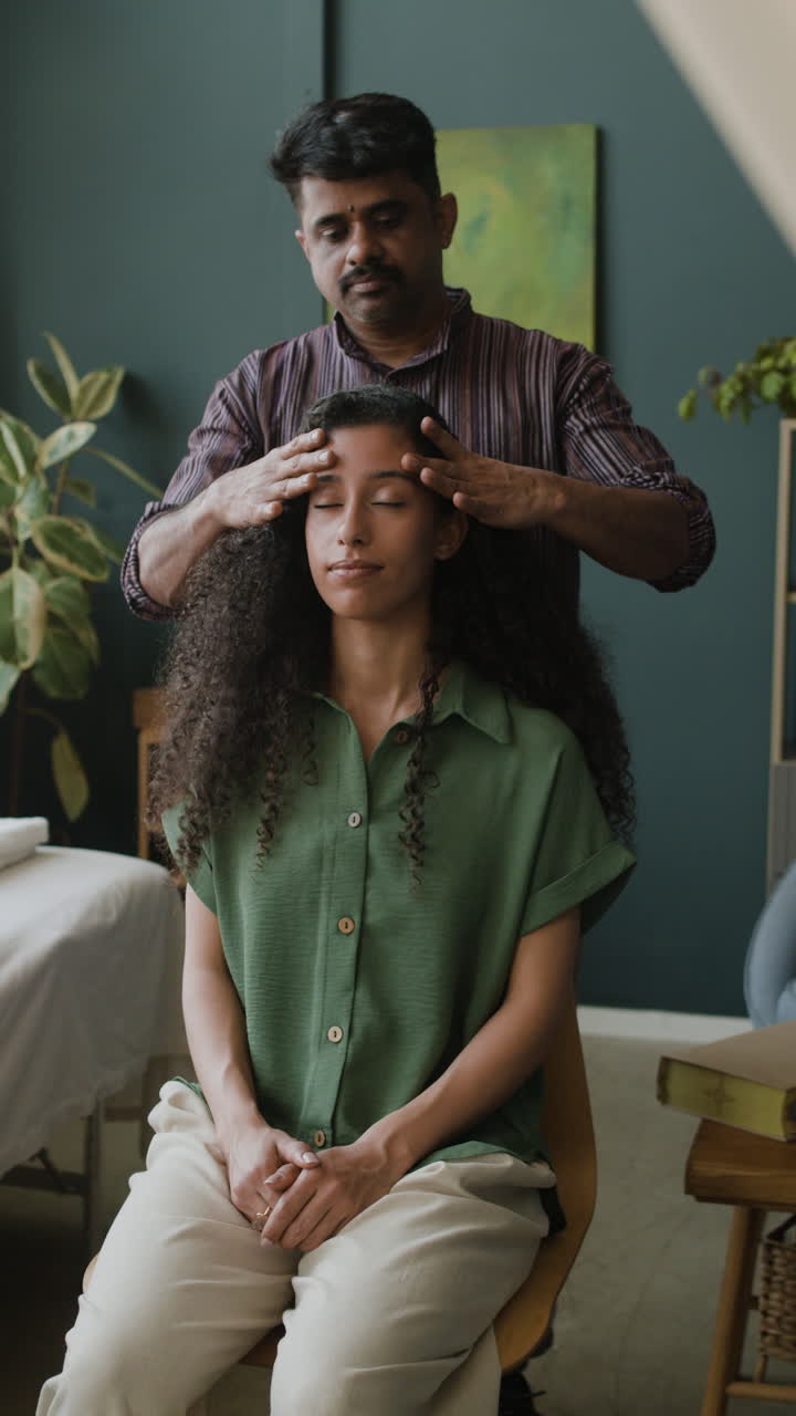 Woman getting a head massage