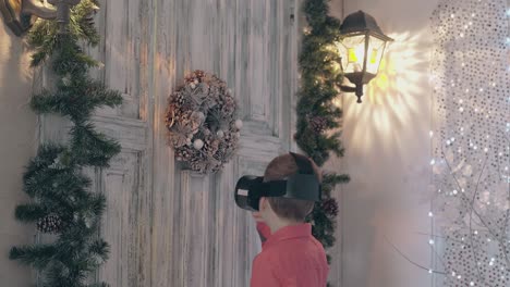 boy in modern vr headset plays around and knocks on door